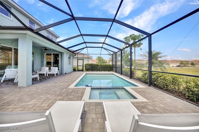 2369 Tangerine Ln, Naples, FL 34120 - view of swimming pool with a patio area, a ceiling fan, a pool with connected hot tub, and glass enclosure