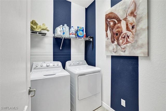 2369 Tangerine Ln, Naples, FL 34120 - laundry room featuring washer and dryer and a textured wall