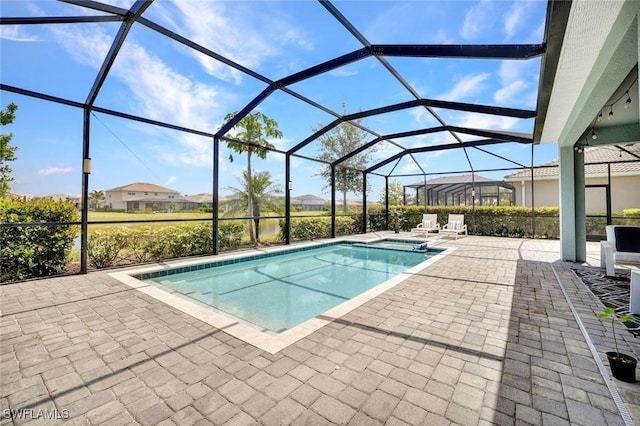 2369 Tangerine Ln, Naples, FL 34120 - outdoor pool featuring a patio area and glass enclosure
