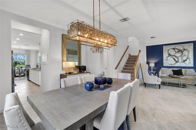 2369 Tangerine Ln, Naples, FL 34120 - dining space featuring a chandelier, stairway, light tile patterned floors, and recessed lighting
