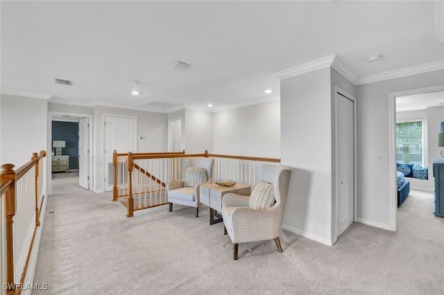 2369 Tangerine Ln, Naples, FL 34120 - sitting room with carpet floors, an upstairs landing, baseboards, recessed lighting, and ornamental molding