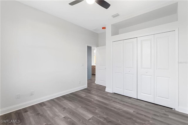 16077 Coruna Ct, Punta Gorda, FL 33955 - unfurnished bedroom with wood finished floors, baseboards, a closet, and ceiling fan