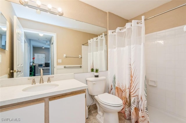 6461 Aragon Way Unit 102, Fort Myers, FL 33966 - full bathroom with vanity, toilet, and a tile shower