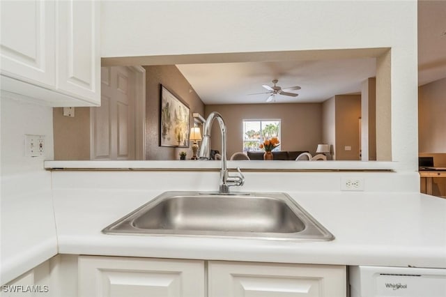 6461 Aragon Way Unit 102, Fort Myers, FL 33966 - kitchen with a sink, white dishwasher, a ceiling fan, light countertops, and white cabinetry