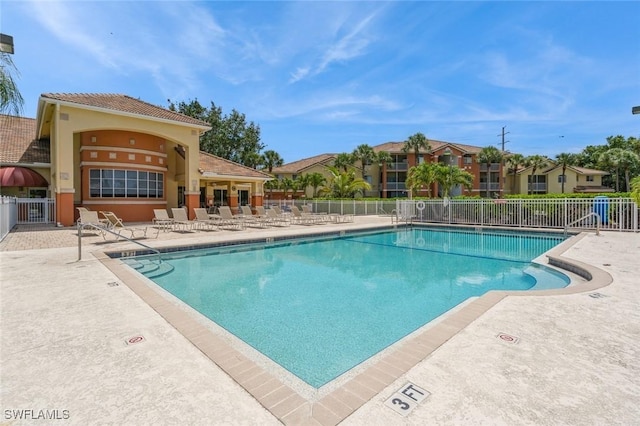 6461 Aragon Way Unit 102, Fort Myers, FL 33966 - community pool with a patio and fence