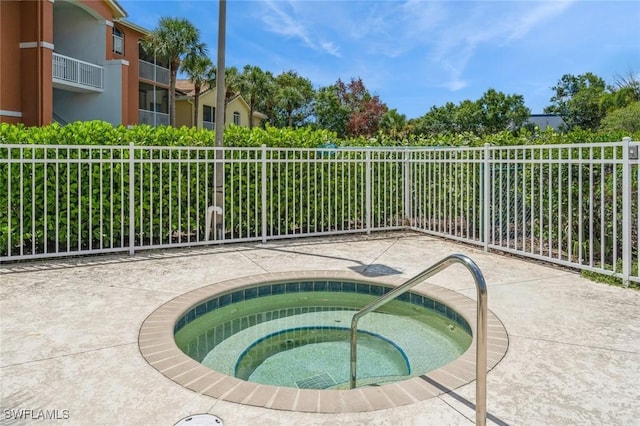 6461 Aragon Way Unit 102, Fort Myers, FL 33966 - view of pool with a hot tub and fence