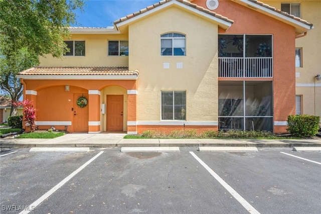 6461 Aragon Way Unit 102, Fort Myers, FL 33966 - view of property featuring uncovered parking