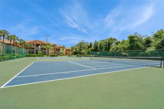 6461 Aragon Way Unit 102, Fort Myers, FL 33966 - view of tennis court featuring fence and community basketball court