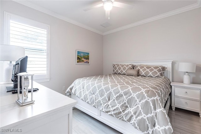 bedroom with crown molding and a ceiling fan