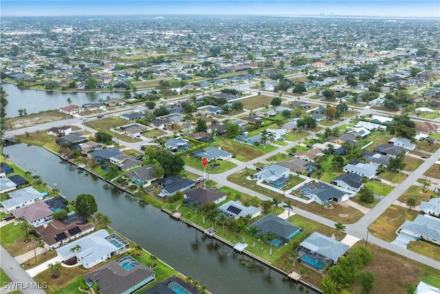 view of property location with nearby suburban area and a large body of water