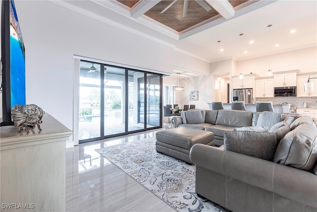 living area featuring ornamental molding, beamed ceiling, recessed lighting, and a towering ceiling