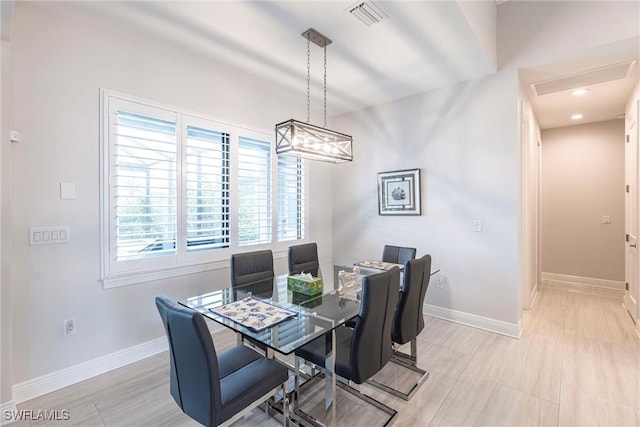 dining area featuring baseboards