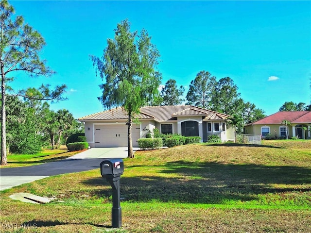 3290 37th Ave NE, Naples, FL 34120 - mediterranean / spanish house with a tile roof, stucco siding, concrete driveway, an attached garage, and a front lawn