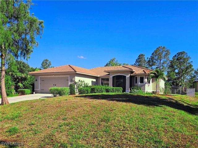 3290 37th Ave NE, Naples, FL 34120 - mediterranean / spanish house with a tiled roof, stucco siding, an attached garage, and concrete driveway