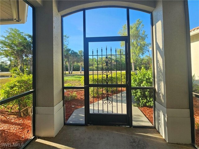 3290 37th Ave NE, Naples, FL 34120 - entryway featuring plenty of natural light and a textured wall