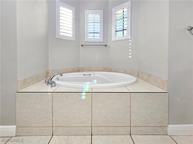 3290 37th Ave NE, Naples, FL 34120 - bathroom featuring a garden tub and tile patterned floors