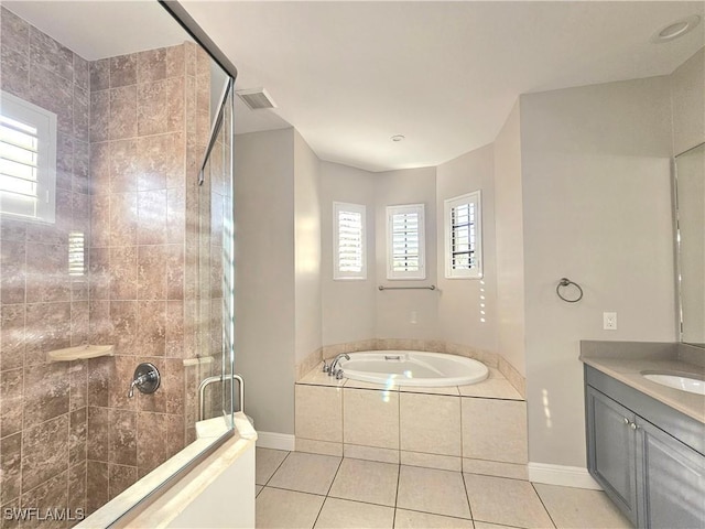 3290 37th Ave NE, Naples, FL 34120 - bathroom featuring a shower stall, tile patterned floors, a bath, baseboards, and vanity