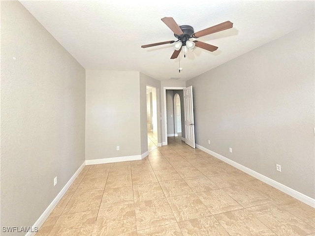 3290 37th Ave NE, Naples, FL 34120 - spare room featuring baseboards and a ceiling fan