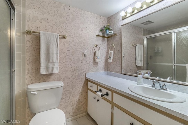 1740 Pine Valley Dr Unit 211, Fort Myers, FL 33907 - full bathroom with vanity, toilet, tile patterned flooring, and an enclosed shower