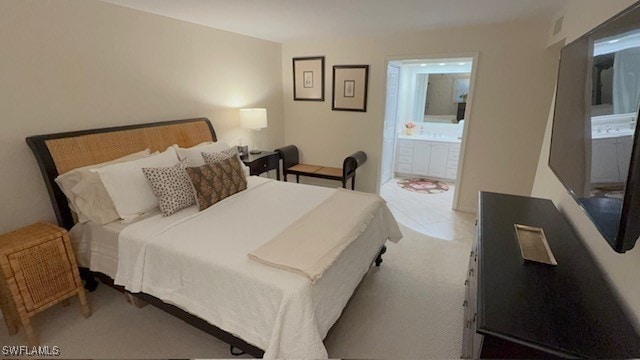2880 Gulf Shore Blvd N Unit 404, Naples, FL 34103 - carpeted bedroom with ensuite bathroom
