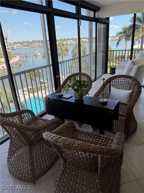 2880 Gulf Shore Blvd N Unit 404, Naples, FL 34103 - sunroom with a water view and healthy amount of natural light