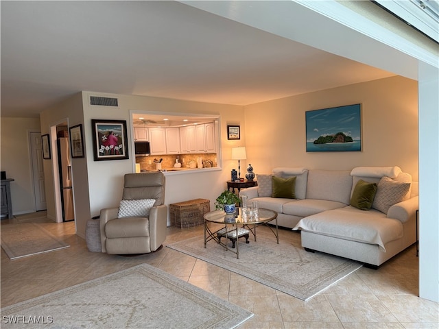 2880 Gulf Shore Blvd N Unit 404, Naples, FL 34103 - living room with light tile patterned floors