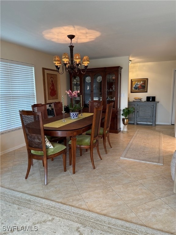2880 Gulf Shore Blvd N Unit 404, Naples, FL 34103 - dining area with a chandelier and light tile patterned floors