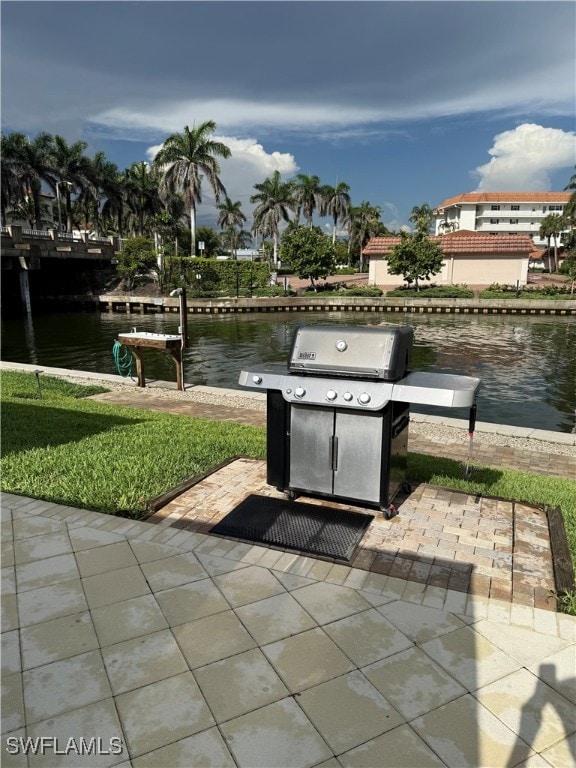 2880 Gulf Shore Blvd N Unit 404, Naples, FL 34103 - view of patio featuring grilling area and a water view