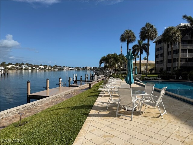 2880 Gulf Shore Blvd N Unit 404, Naples, FL 34103 - dock with a water view, a patio area, and a community pool