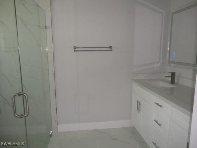 3805 6th St W, Lehigh Acres, FL 33971 - full bath with baseboards, marble look tile flooring, a marble finish shower, and vanity