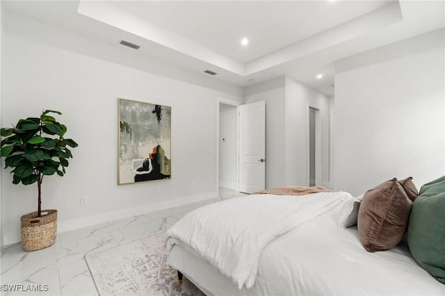 bedroom featuring recessed lighting, a raised ceiling, marble finish floors, and baseboards
