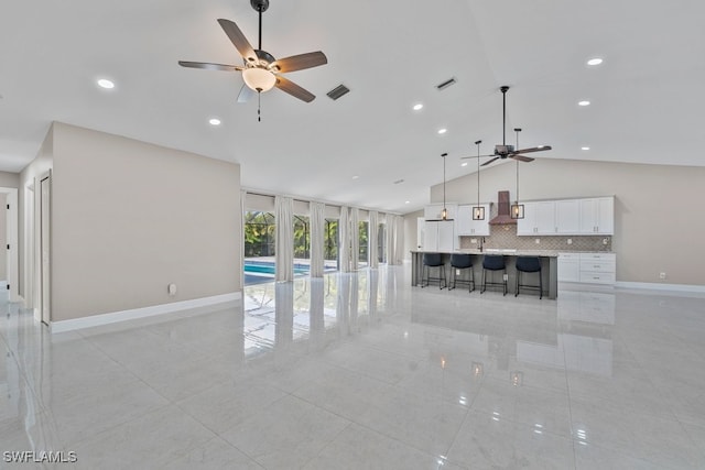 2124 SE 10th Ln, Cape Coral, FL 33990 - unfurnished living room with a ceiling fan, light tile patterned floors, baseboards, high vaulted ceiling, and recessed lighting