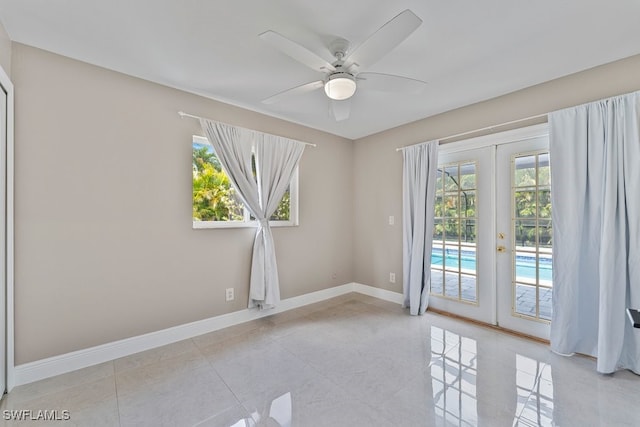 2124 SE 10th Ln, Cape Coral, FL 33990 - unfurnished room with ceiling fan, french doors, and baseboards