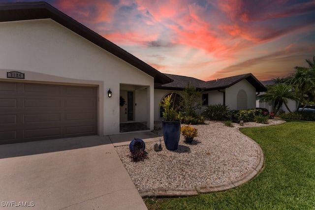 2124 SE 10th Ln, Cape Coral, FL 33990 - single story home with stucco siding, a yard, a garage, and concrete driveway
