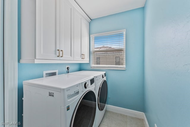 2124 SE 10th Ln, Cape Coral, FL 33990 - laundry room featuring cabinet space, separate washer and dryer, baseboards, and light tile patterned flooring