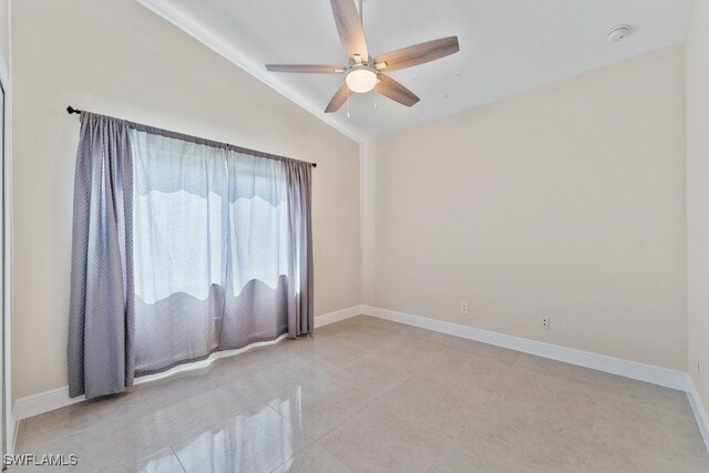 2124 SE 10th Ln, Cape Coral, FL 33990 - spare room featuring lofted ceiling, ceiling fan, baseboards, a smoke detector, and light tile patterned floors