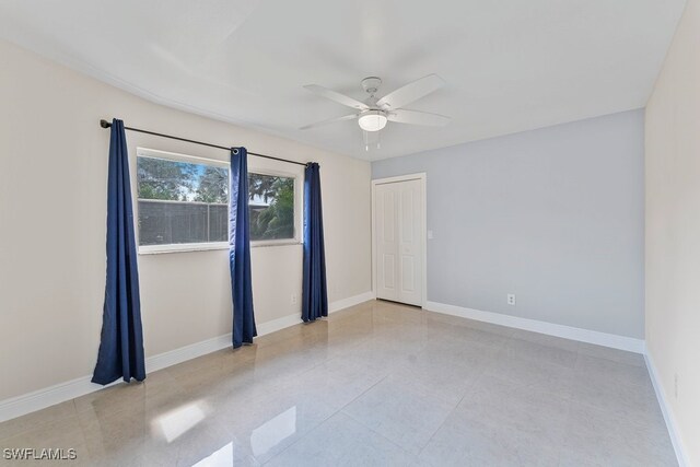 2124 SE 10th Ln, Cape Coral, FL 33990 - spare room with ceiling fan and baseboards