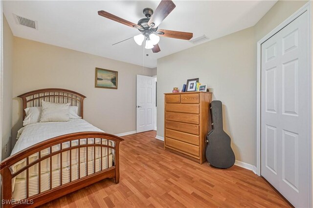 27006 Elaine Dr, Bonita Springs, FL 34135 - bedroom featuring baseboards, light wood finished floors, and a ceiling fan