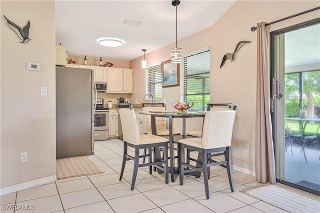 27006 Elaine Dr, Bonita Springs, FL 34135 - dining area featuring light tile patterned floors and baseboards