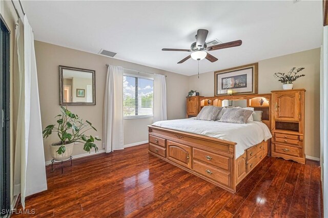 27006 Elaine Dr, Bonita Springs, FL 34135 - bedroom with dark wood-style floors, baseboards, and ceiling fan