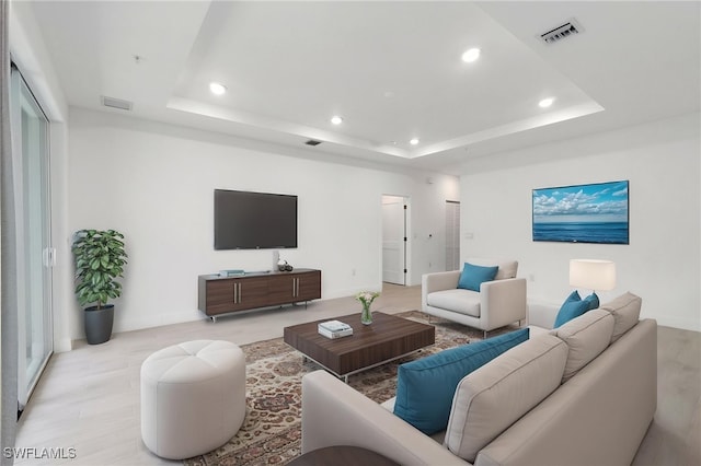 26380 Coco Cay Cir Unit 101, Bonita Springs, FL 34135 - living area with recessed lighting, a tray ceiling, light wood-type flooring, and baseboards