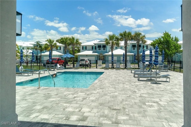 26380 Coco Cay Cir Unit 101, Bonita Springs, FL 34135 - community pool featuring a patio and a residential view
