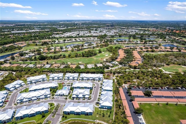 26380 Coco Cay Cir Unit 101, Bonita Springs, FL 34135 - aerial view of property and surrounding area with a nearby body of water, a golf course, and nearby suburban area