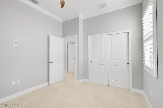 11810 Timbermarsh Ct, Fort Myers, FL 33913 - unfurnished bedroom with light carpet, multiple windows, crown molding, baseboards, and a closet
