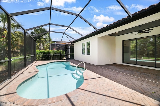 11810 Timbermarsh Ct, Fort Myers, FL 33913 - outdoor pool with a patio area, a ceiling fan, and glass enclosure