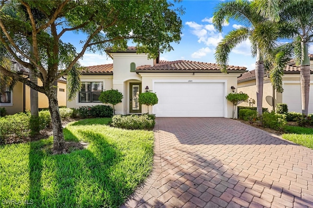 11810 Timbermarsh Ct, Fort Myers, FL 33913 - mediterranean / spanish house featuring stucco siding, a garage, decorative driveway, and a tiled roof