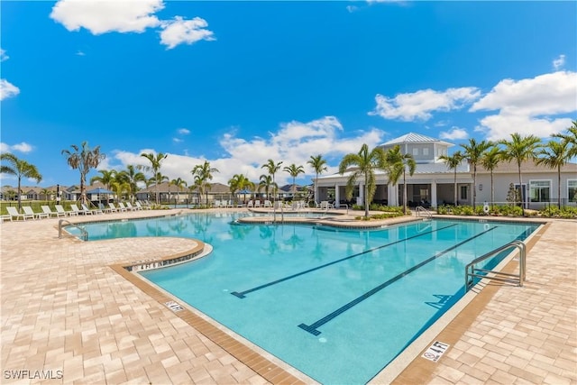 16515 Fire Coral Ln, North Fort Myers, FL 33903 - community pool featuring a patio