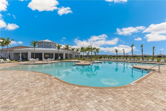 16515 Fire Coral Ln, North Fort Myers, FL 33903 - community pool featuring a patio