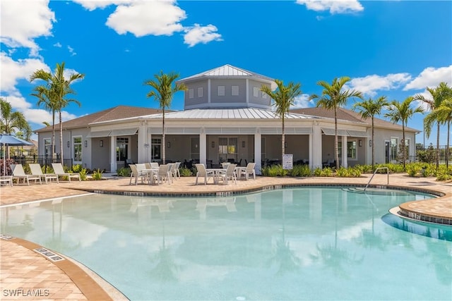16515 Fire Coral Ln, North Fort Myers, FL 33903 - community pool featuring a patio area