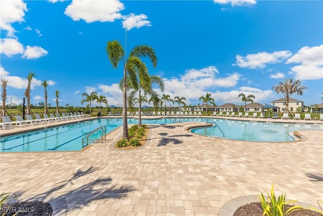 16515 Fire Coral Ln, North Fort Myers, FL 33903 - community pool featuring a patio area